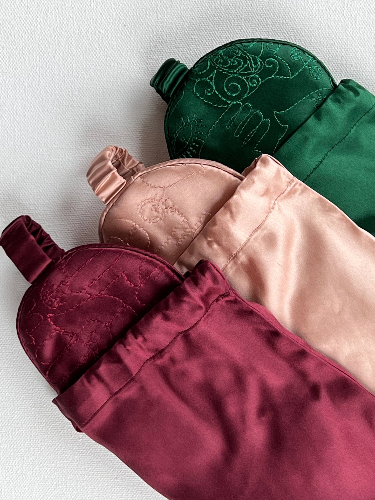 Sleek collection of silk eye masks with Hamsa embroidery