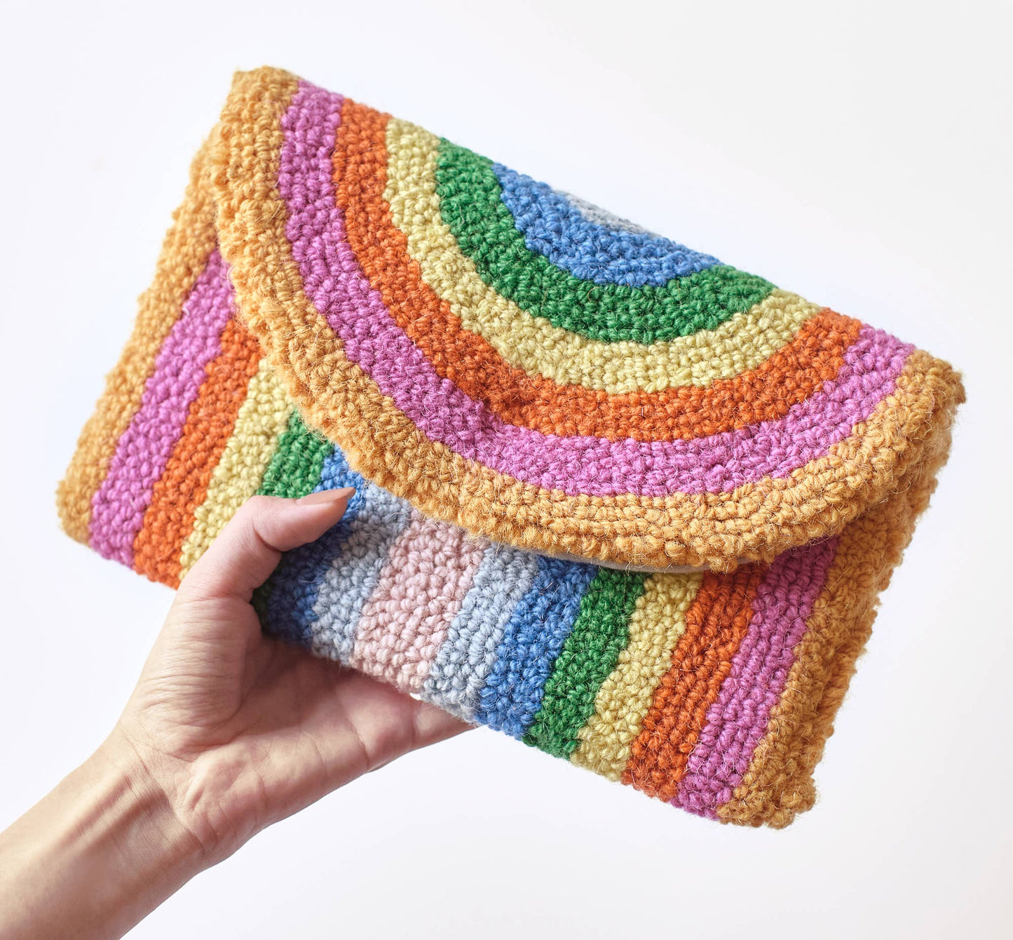 Light and bright wool clutch with pastel rainbow design throughout