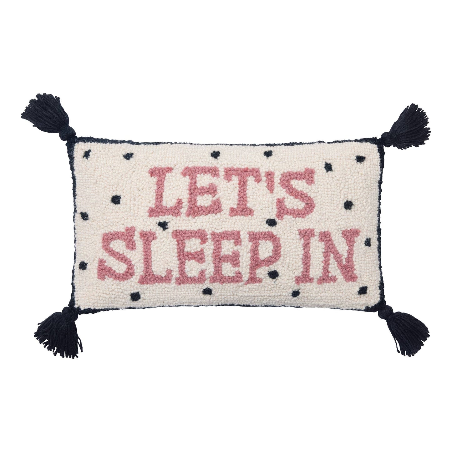 Black and white dotted, tassels novelty pillow with “Let’s Sleep In” pink letters