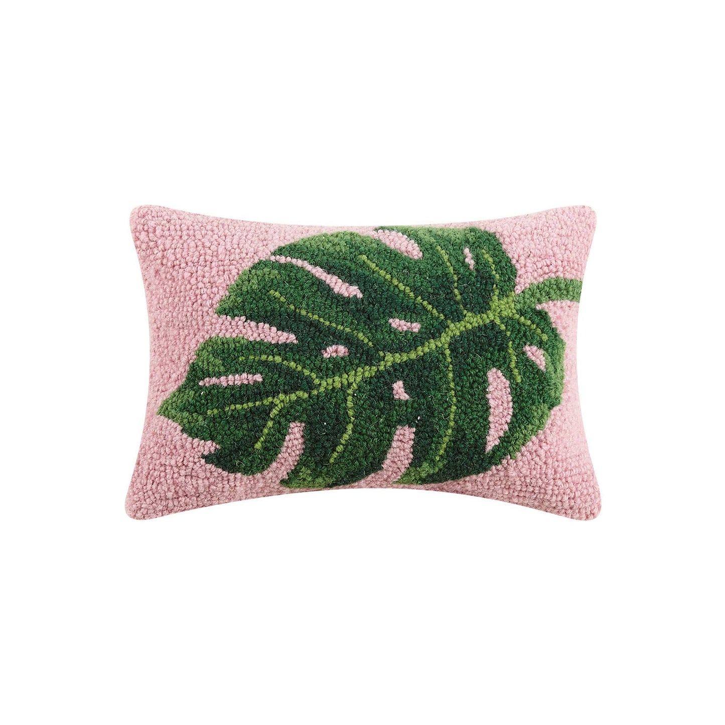 Pink throw pillow with green palm leaf displayed across the center