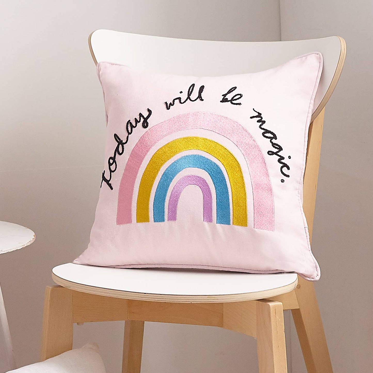 Inspiring kids and youth pillow in pink adorned with message “today will be magic.”