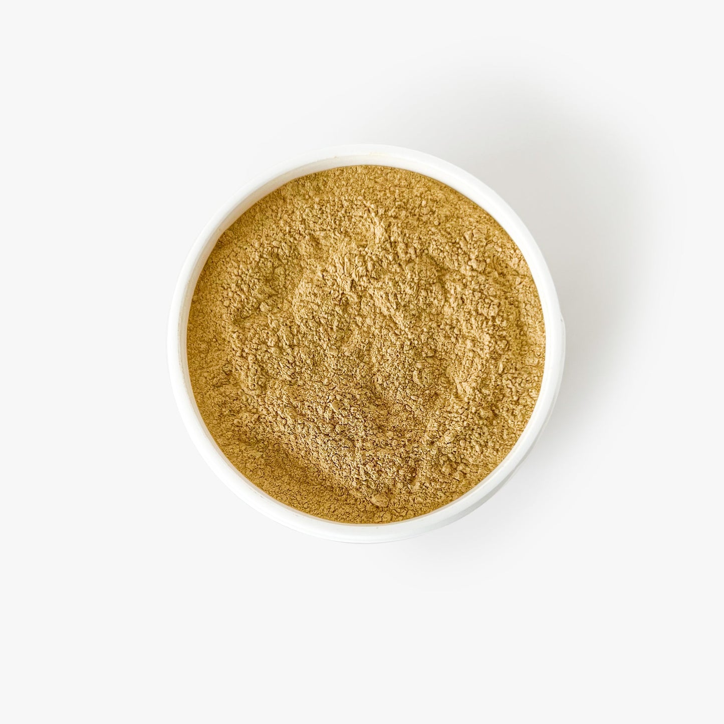 Brightening Turmeric and Sandalwood clay mask with beautiful golden color.