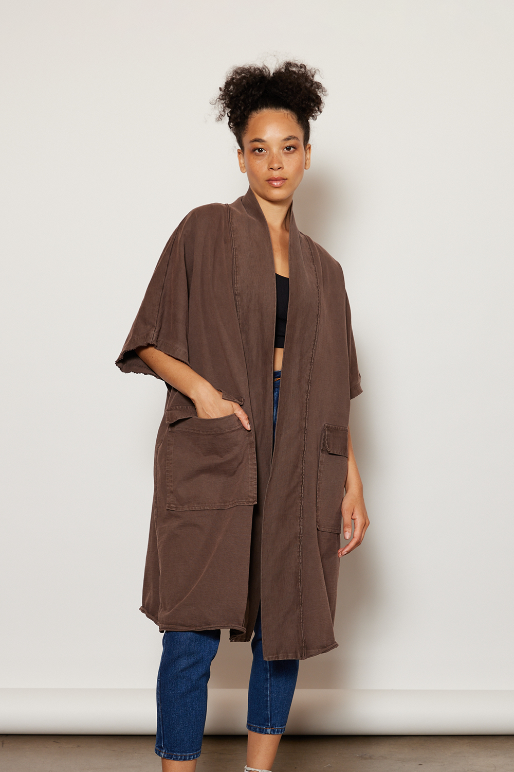 Chocolate colored oversized knee-length boho jacket made from vintage cotton fabric and features large square outer pockets.