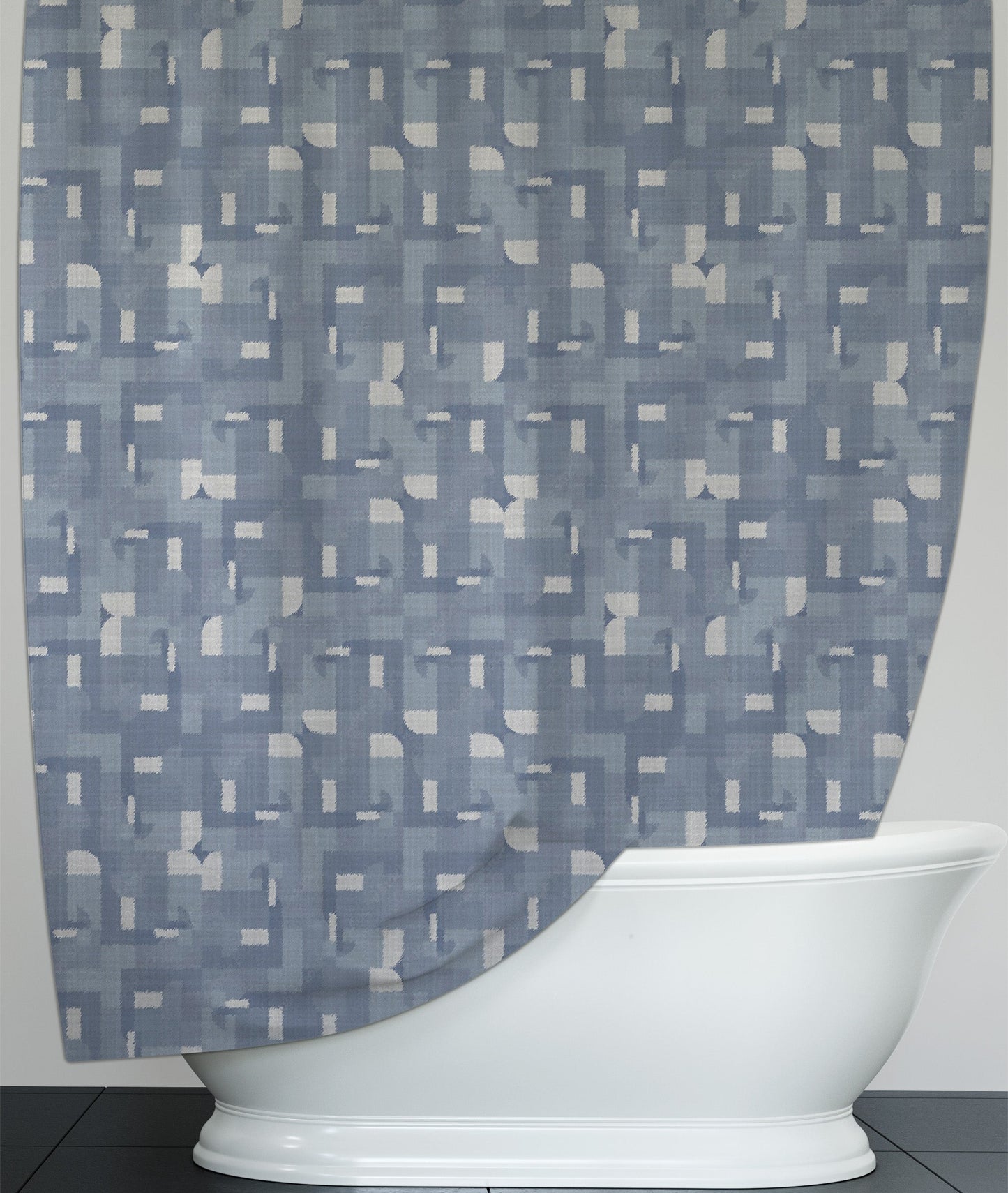 Modern bathroom featuring washable shower curtain with blue and white kaleidoscope design.