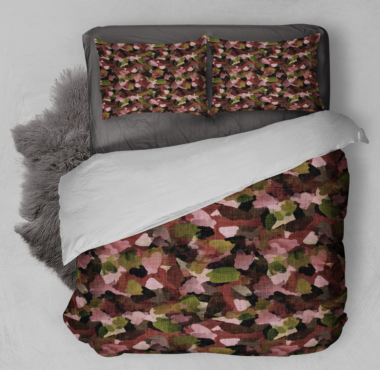 Simplistic bedroom featuring abstract autumn leaves duvet set with complementary shag rug.