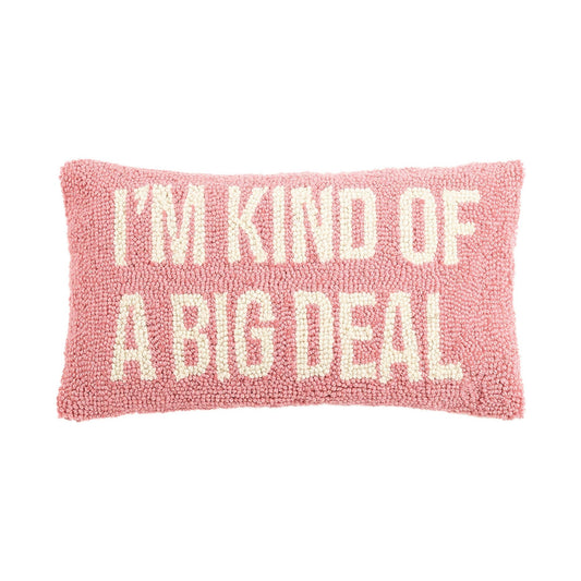 Plush pink novelty accent pillow with “I’m Kind of a big deal” in all white caps