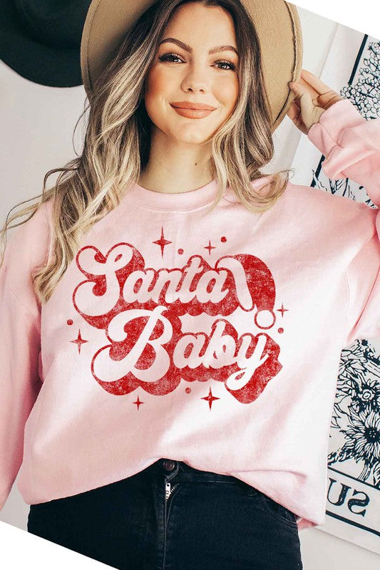 Light pink long sleeve sweatshirt with sparkle vintage Santa Baby graphic in red