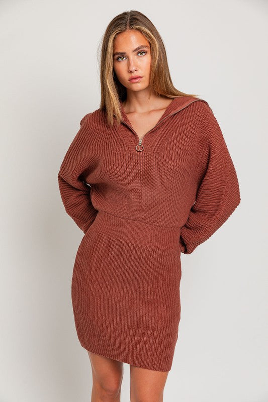 Chocolate brown long sleeve, midi knit dress with ribbed design, front zipper and extended collar.