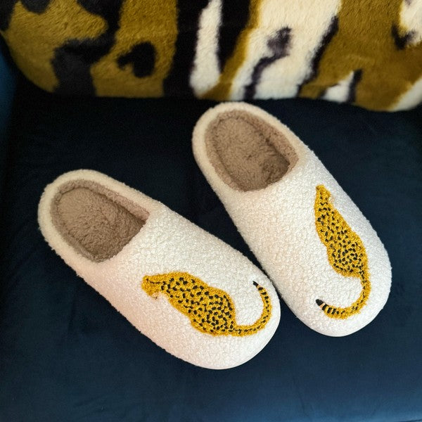 Fuzzy white slippers with cheetah embroidered design