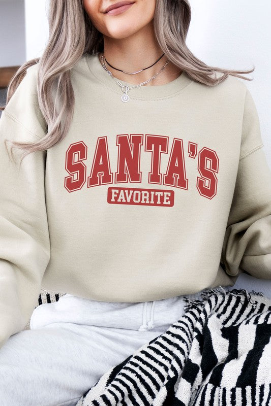 Beige relaxed fit sweatshirt with “Santa’s Favorite” graphics in red varsity letters