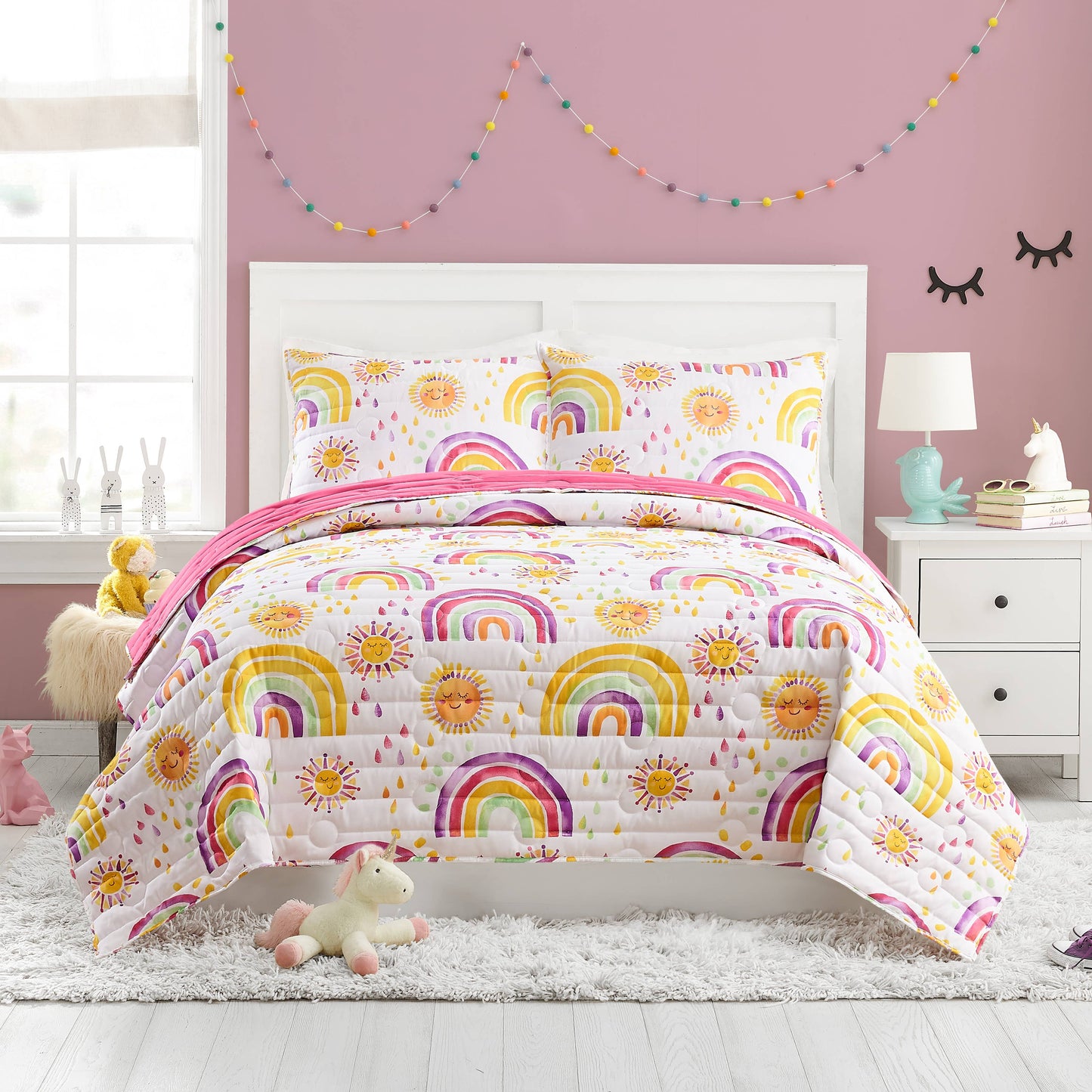 Darling quilt with a medley of colorful raindrops, rainbows, and suns