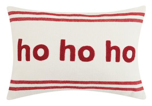 White bouclé
 pillow with red horizontal stripes that reads “ho ho ho” in red letters in the center