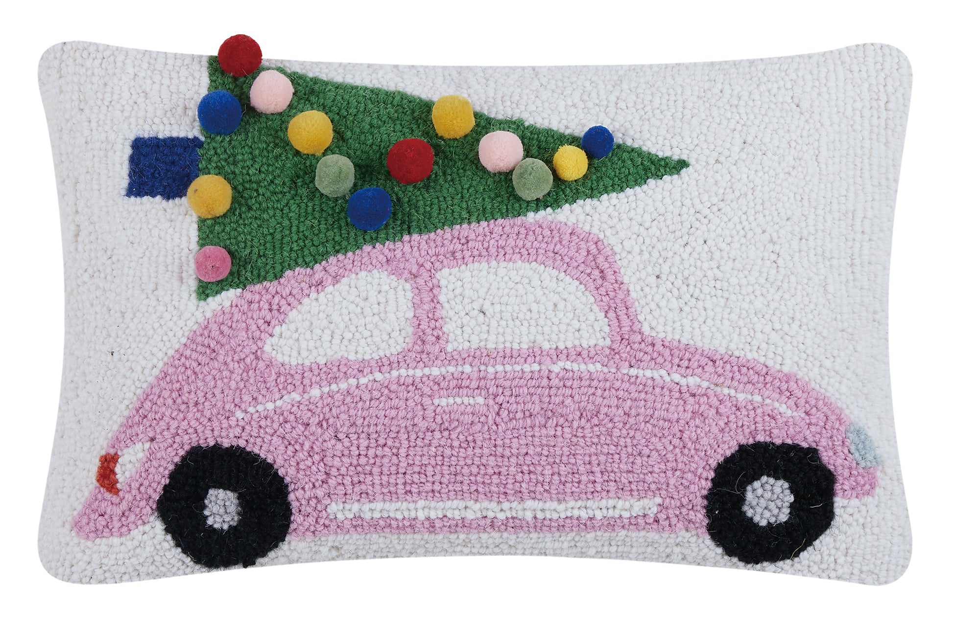 Pink punch buggy pillow hauling Christmas tree decorated with pom poms for ornaments 