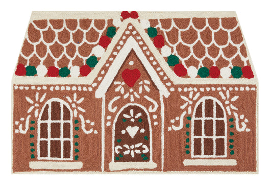 Brown and white gingerbread house rug made of wool with red, white and green dotted trim