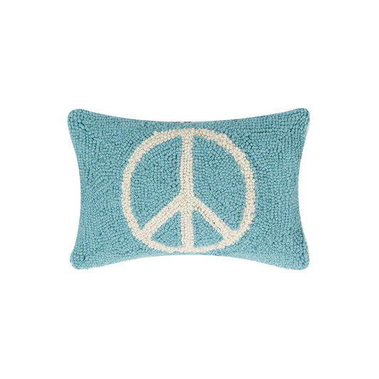 Cool blue wool hooked lumbar shaped pillow with peace design displayed in white across the center