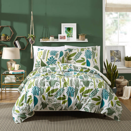 Garden inspired duvet cover with green and teal leaf motifs on reversible white spread