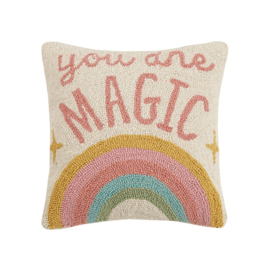 Soft accent pillow featuring pastel rainbow below inspiring message “you are magic” 