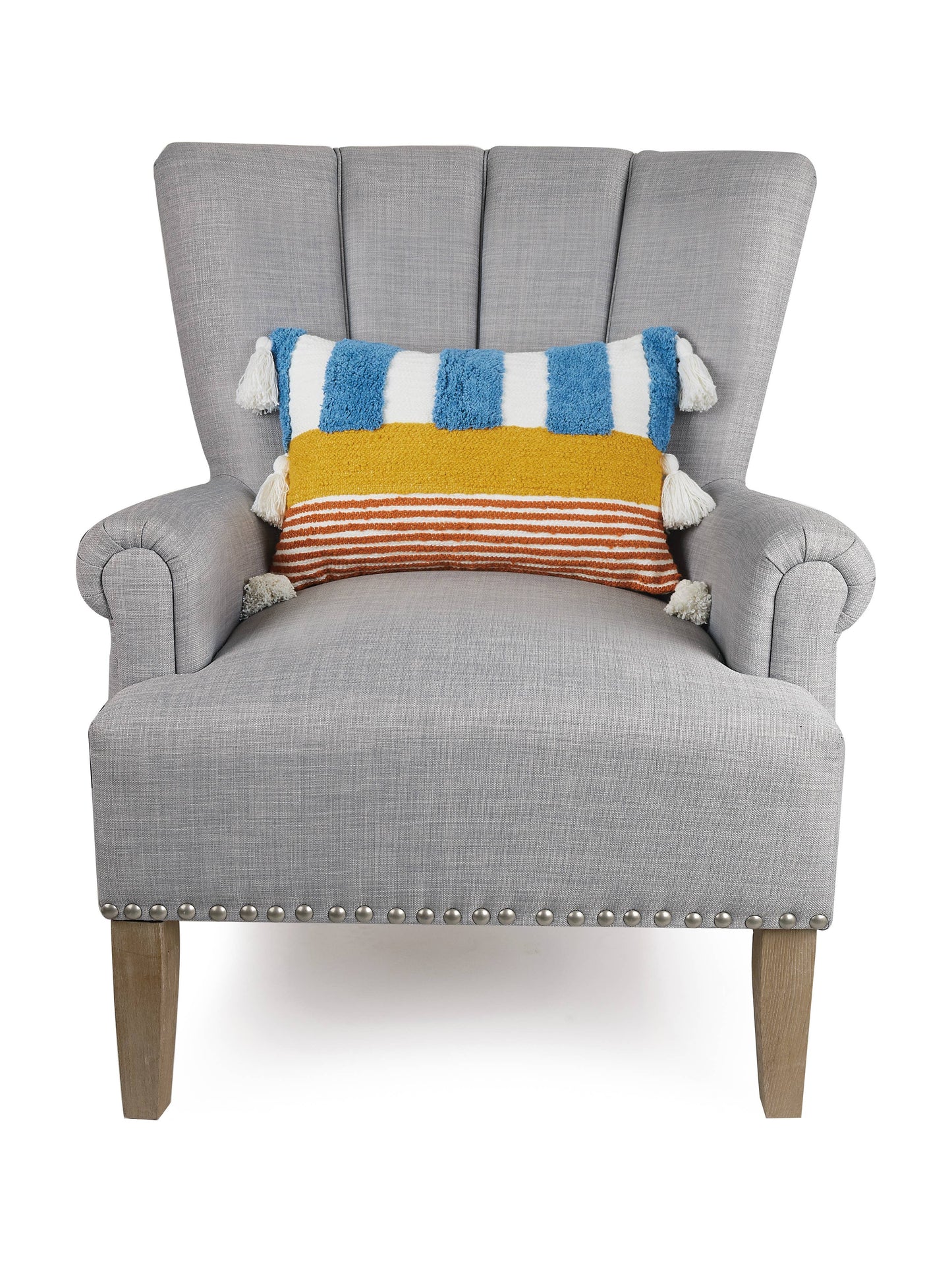 Color block pillow (red, white, blue, yellow) with circus-like display and fun tassels