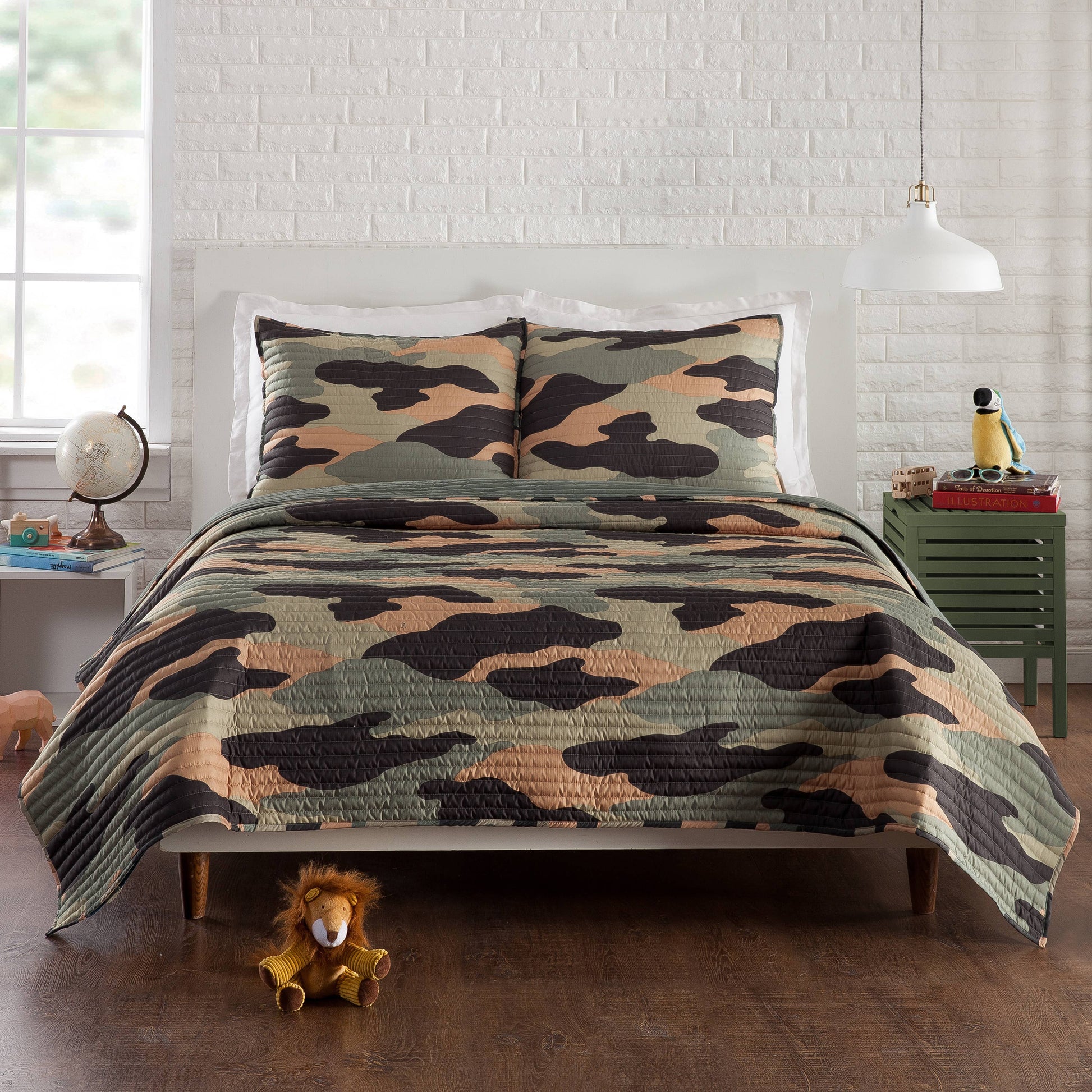 Camouflage quilt with cool color trio of black, peach and green on cozy polyester