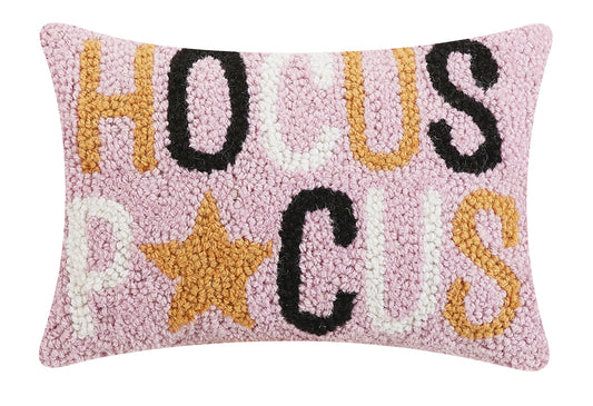 Pink wool hooked, 8”x12” pillow with Hocus P⭐️cus spelled in Orange, Black and White Letters. 
