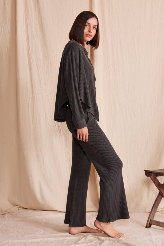 Comfy 3/4 relaxed fit pants in vintage ash black color featuring waffle print.