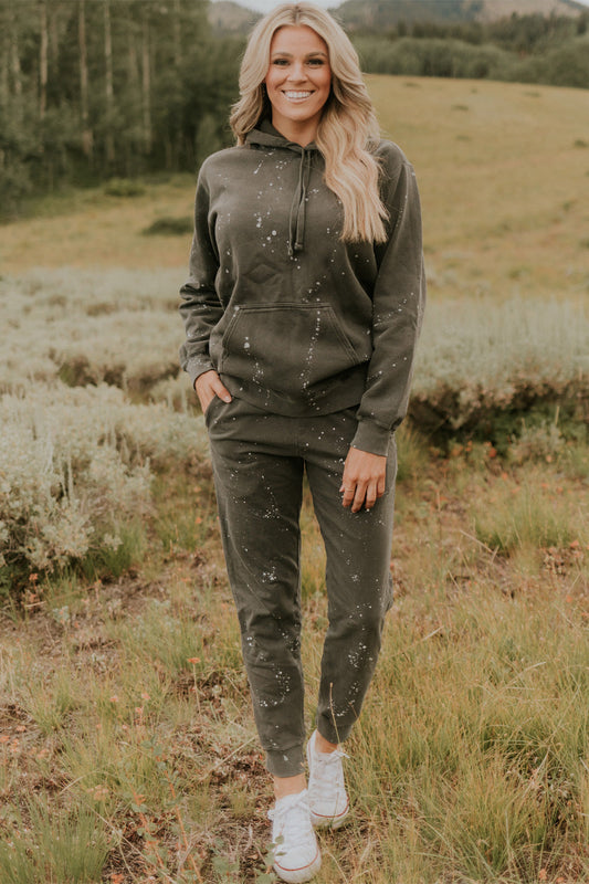Relaxed fit ash gray hoodie with matching joggers featuring speckled design on vintage cotton fabric.