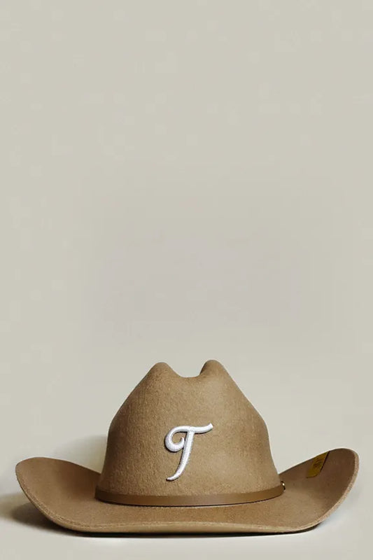 Chocolate brown wool cowboy hat, for unisex wear, featuring “T” embroidered in white cursive lettering  with faux leather brown trim.