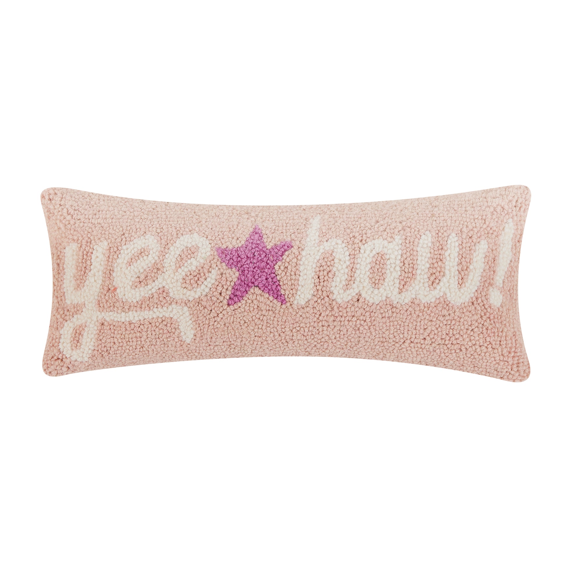 Soft pink wool hooked lumbar shaped pillow with “yee haw! In white cursive letters and purple star in the middle