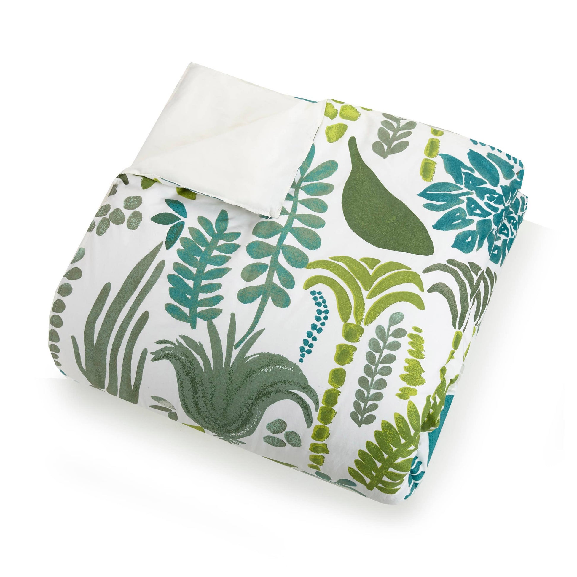 Close up of folded garden design duvet cover with green and teal plant motifs on reversible white spread