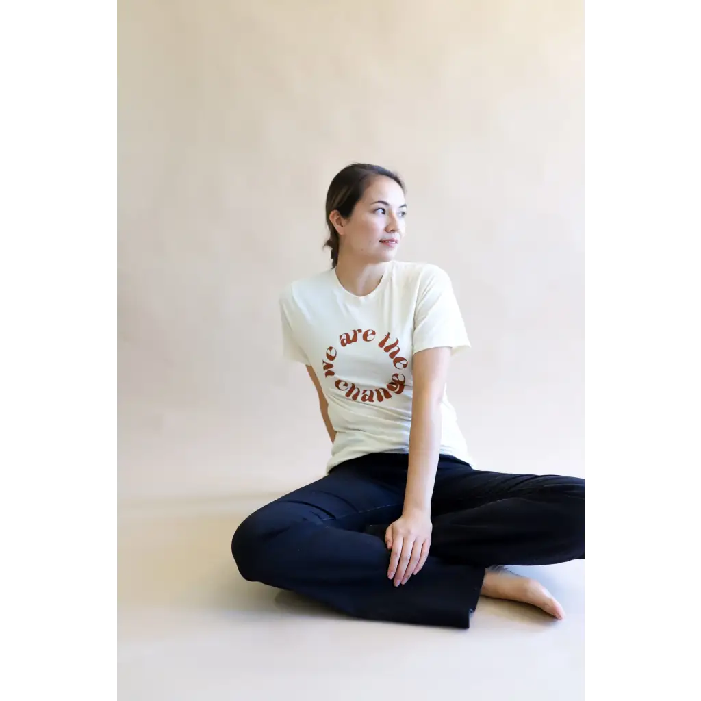 Relaxed Fit Ivory Graphic T-Shirt with brown “we are the change” in circular format