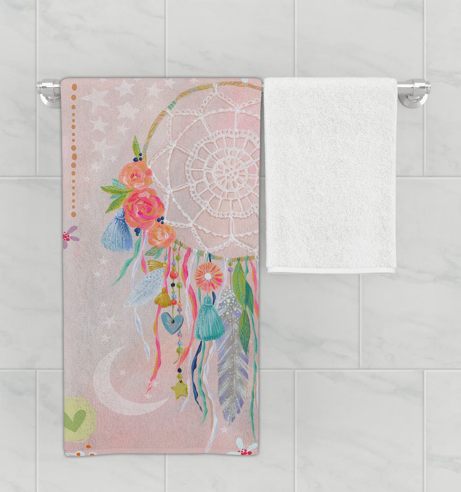 Bathroom rack with kid’s pink, dreamcatcher bath towel.