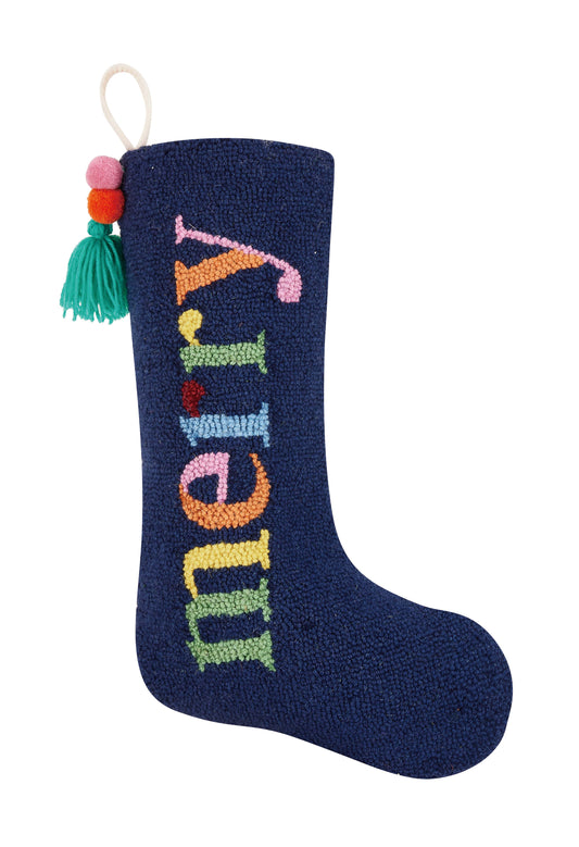 Navy Ampersand holiday stocking with tassel that reads, “Merry” with multi-colored letters