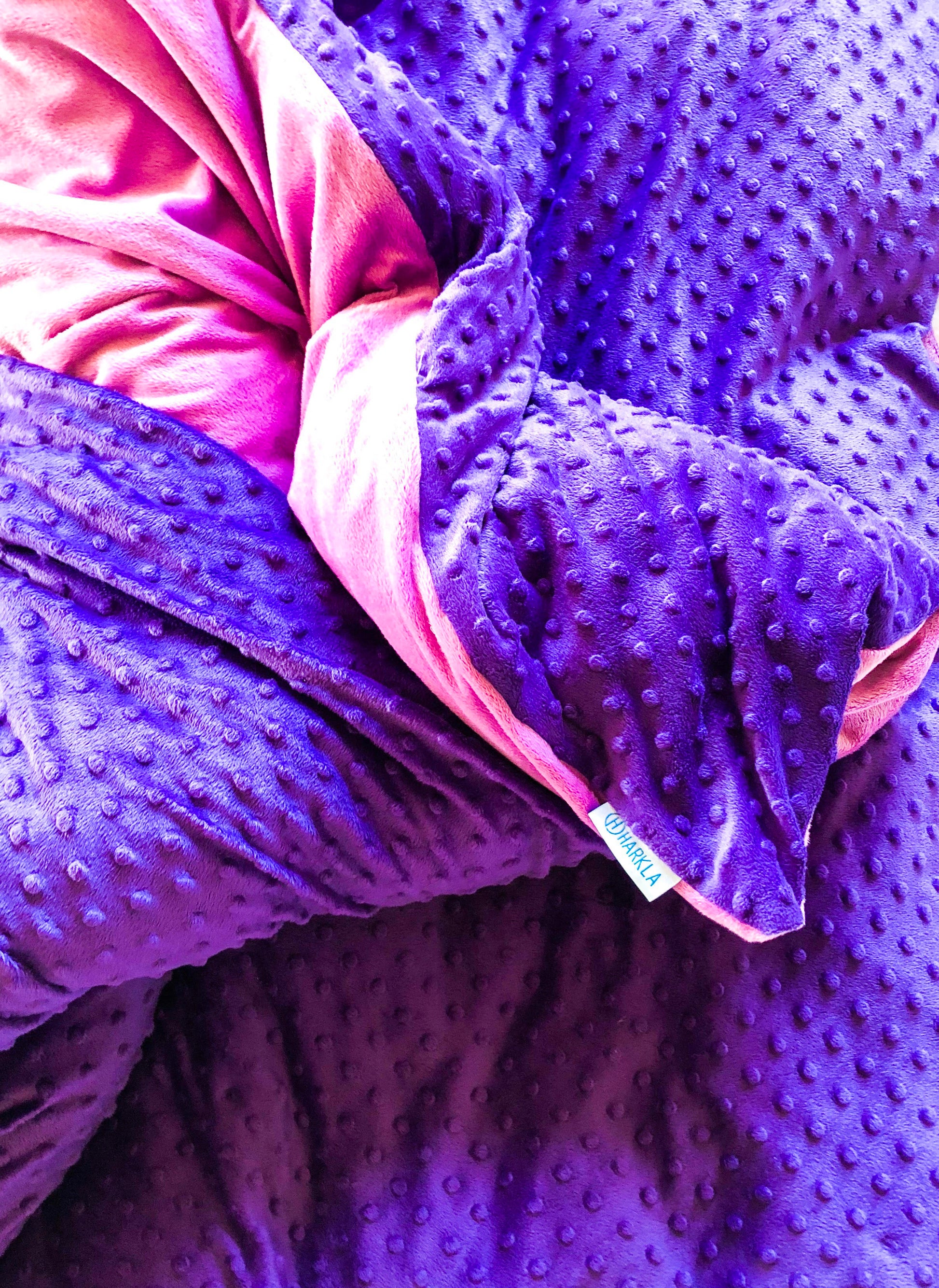 Expanded view of Harkla weighted blanket with dotted purple front and minky lilac reverse.