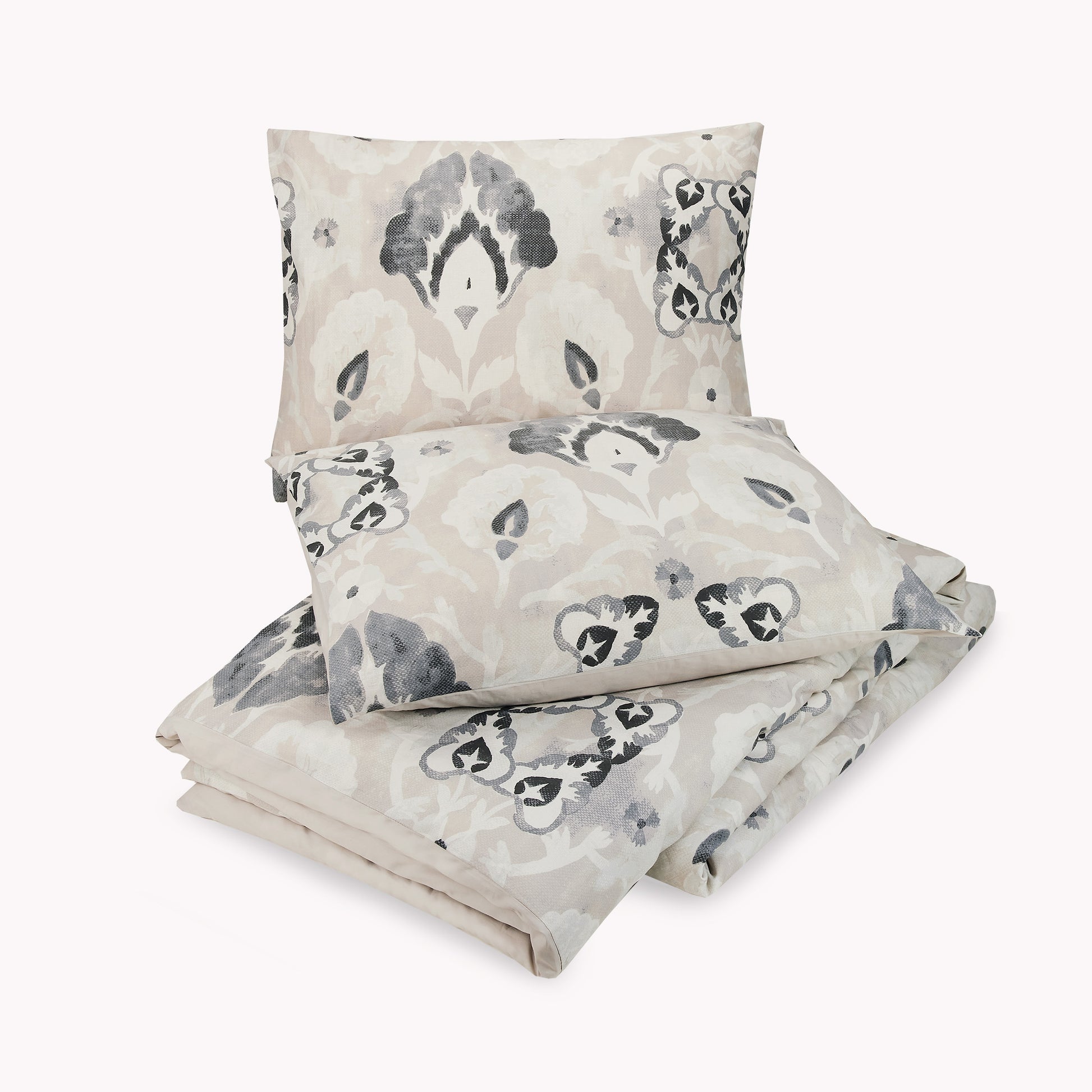 Lemieux Et Cie gray and cream, floral motif duvet with matching pillow covers.