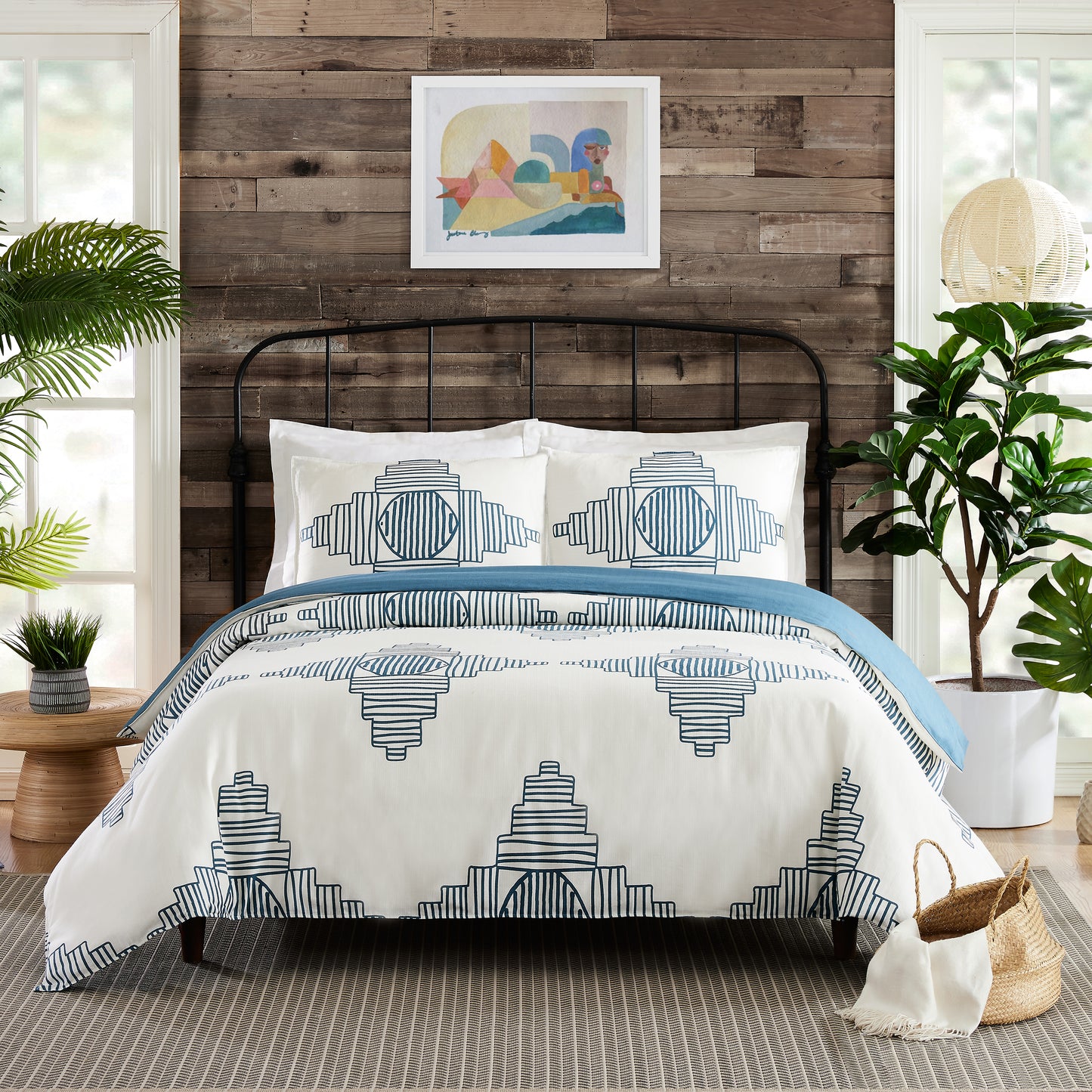 Industrial style bedroom featuring Justina Blakeney reversible duvet cover set with abstract, turquoise and white pattern