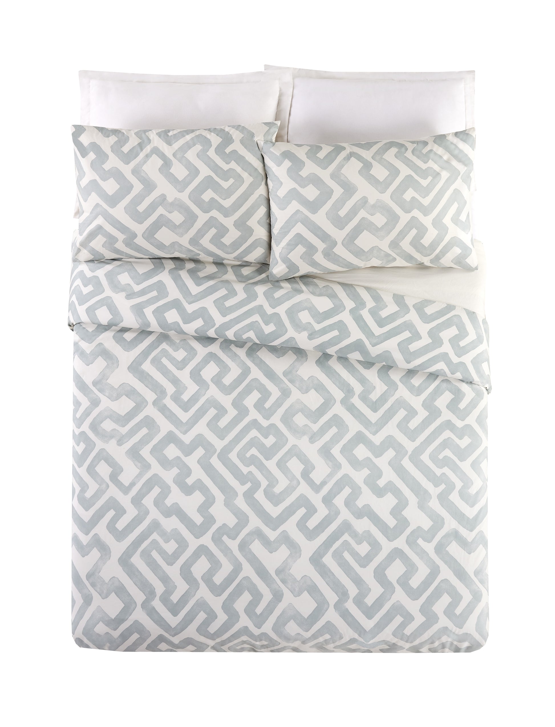 Bed with gray and white puzzle patterned duvet set by Lemieux Et Cie.