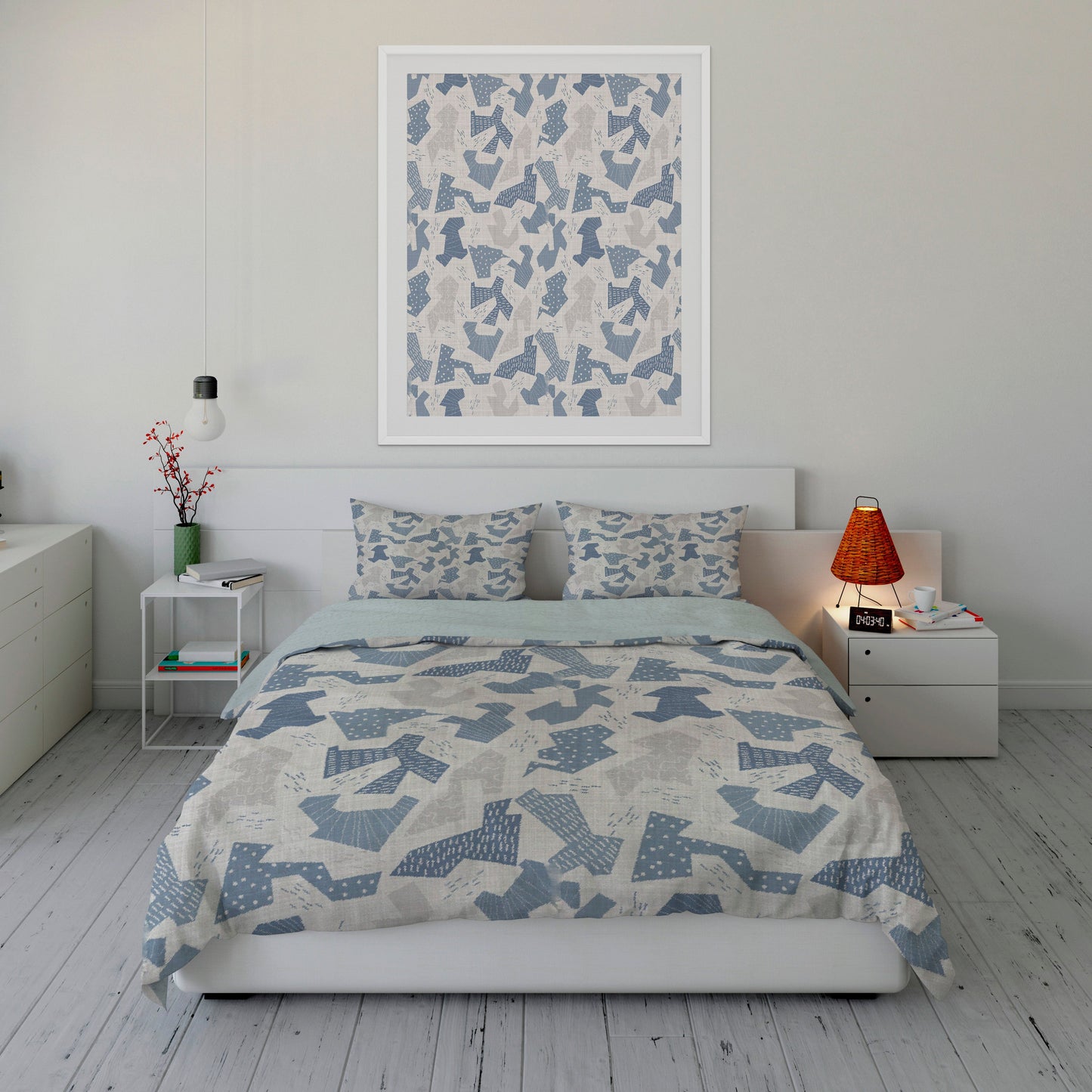 Fresh bedroom displaying abstract blue and gray camouflage comforter set with matching artwork.