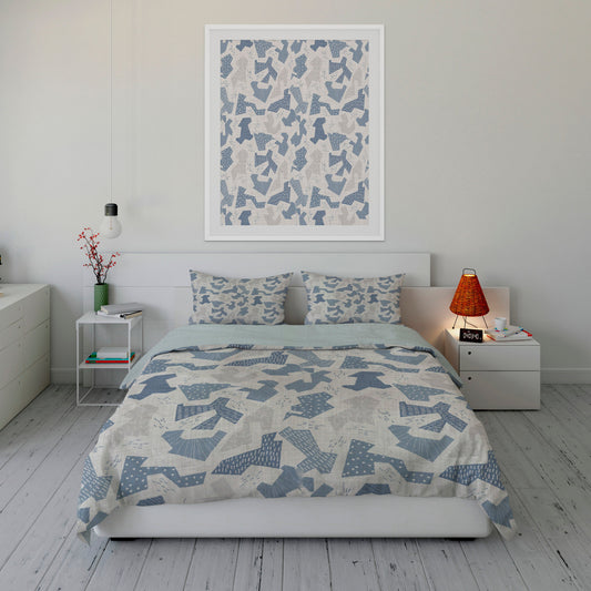 Fresh bedroom displaying abstract blue and gray camouflage comforter set with matching artwork.