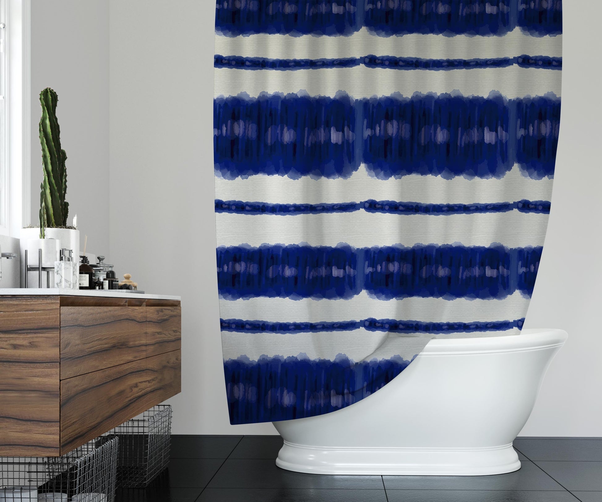 Clean bathroom featuring printed shower curtain with bright blue and white tie-dye design.