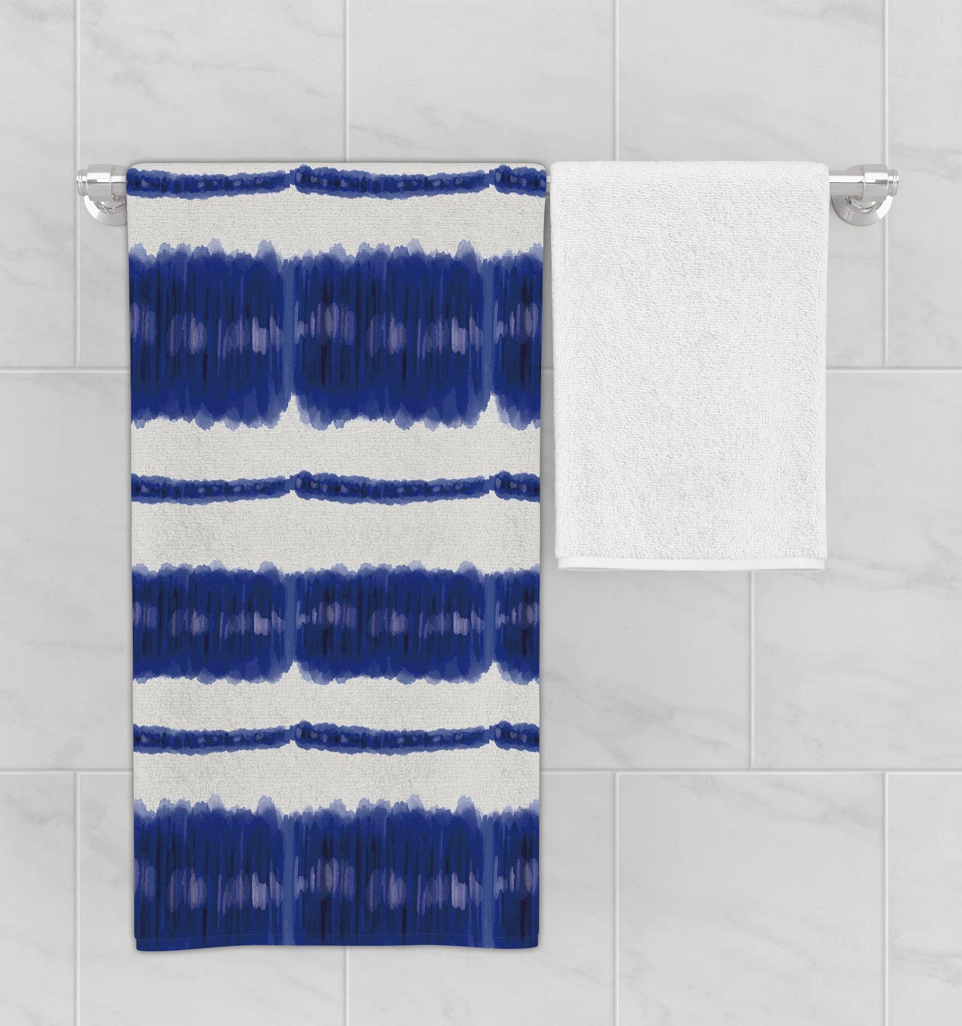 Bathroom rack with hanging microfiber bath towel featuring bright blue and white watercolored, oceanic design.