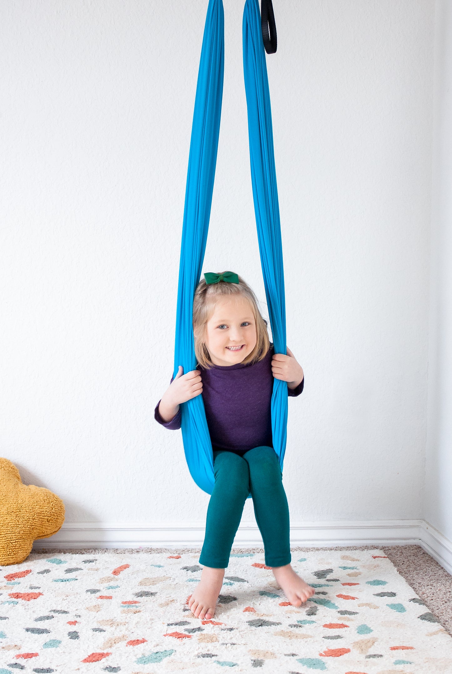 Young girl enjoying Cozy Compression therapy Swing.