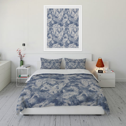 Coastal style bedroom featuring duvet cover set with flowing blue and gray abstract design and matching artwork.