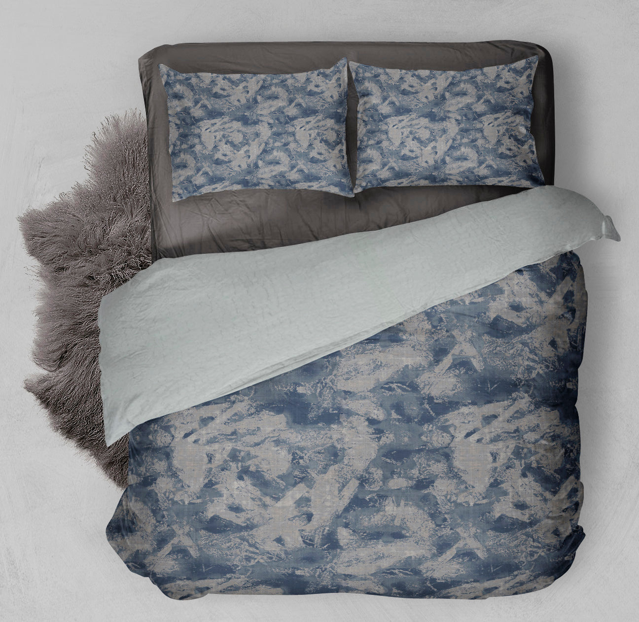 Bed with winter ready Sherpa Comforter Set displaying swirling gray and blue design.