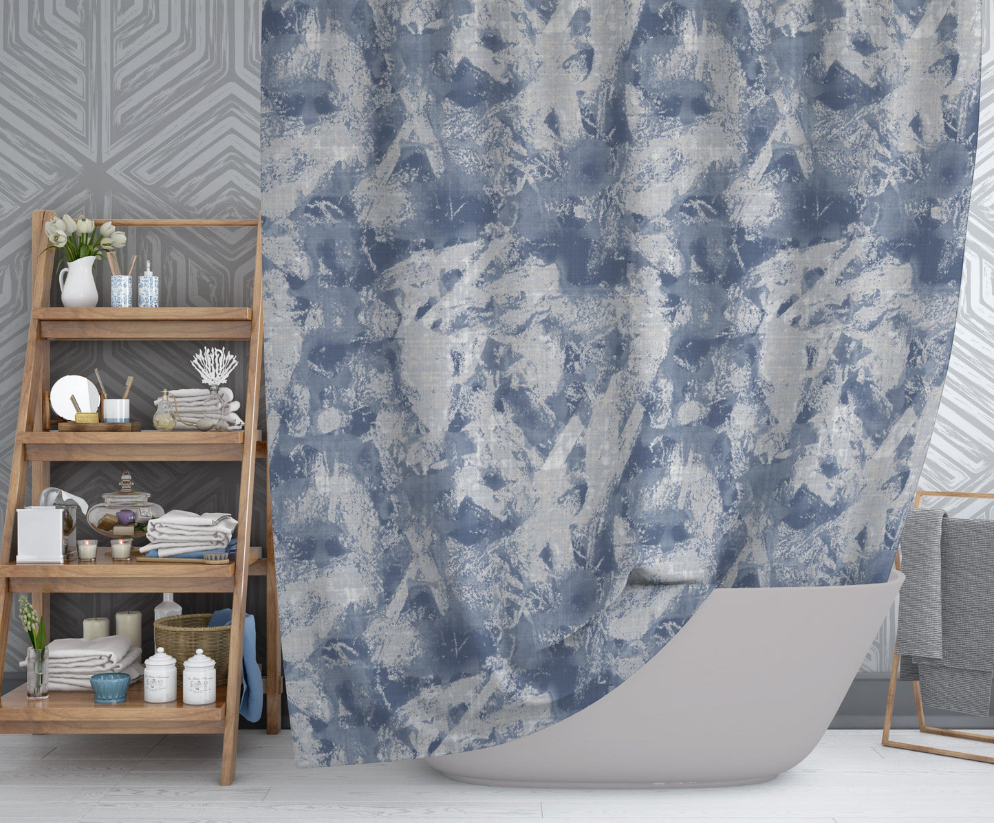 Modern bathroom featuring captivating shower curtain with printed blue and white abstract design.