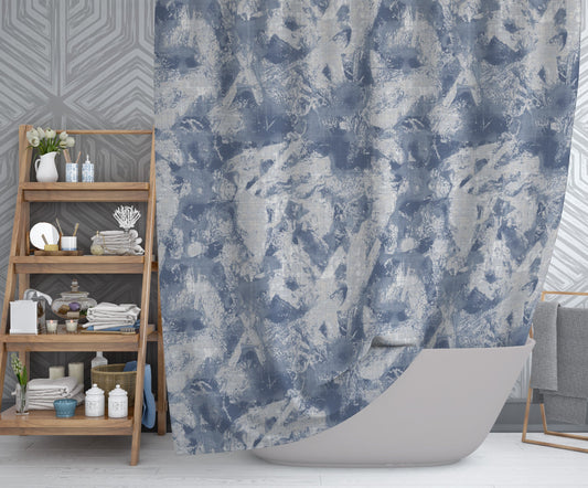 Modern bathroom featuring captivating shower curtain with printed blue and white abstract design.