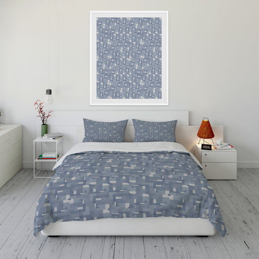Cool toned bedroom featuring plush blue and white Comforter Set with geometric design.