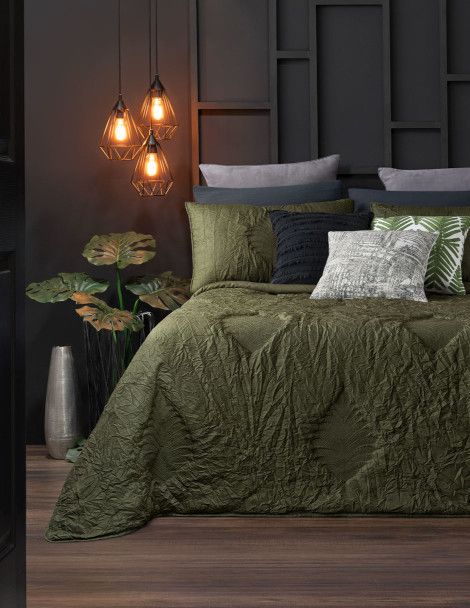 Modern bedroom featuring olive colored, leaf embossed quilt for adults. Luxus Eden Palm Quilt.