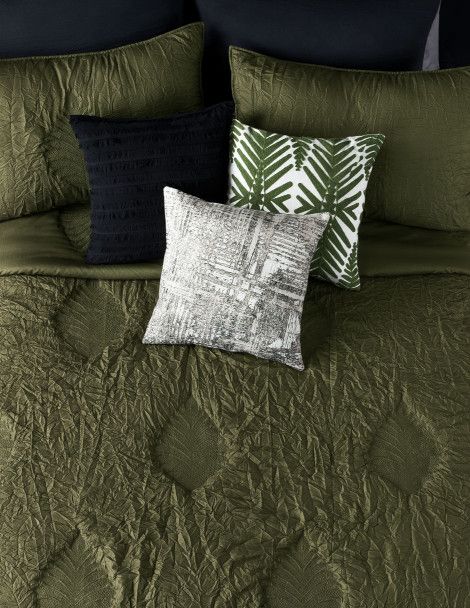 Adult bedding with unique, embossed, olive green leaf design throughout.