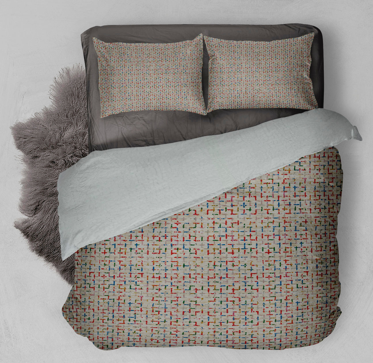 Bed with winter ready Sherpa comforter displaying invigorating printed design with colorful pattern throughout.