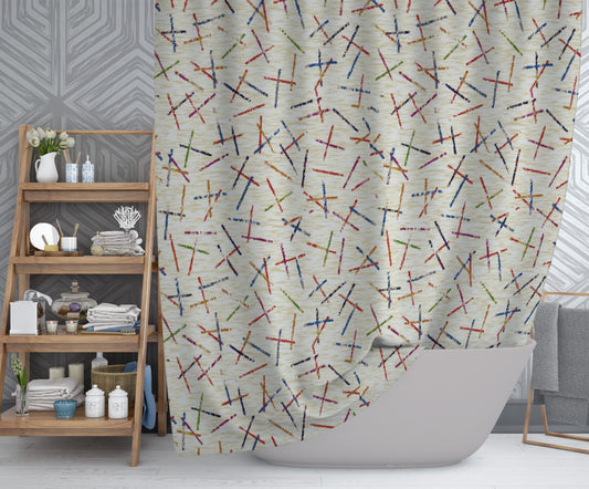 Modern bathroom featuring tan printed shower curtain with vibrant intersecting lines pattern.